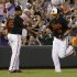 Baltimore Orioles' Chris Davis, right, fist-bumps third base coach DeMarlo Hale after hitting a solo home run in the second inning of a baseball game against the Toronto Blue Jays in Baltimore, Friday, Aug. 24, 2012. (AP Photo/Patrick Semansky)