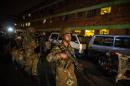 South African Army soldiers leave the suburb of Jeppestown at the end of a joint police and army raid in Johannesburg on April 21, 2015