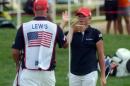 Stacy Lewis, right, high-fives her caddie after winning over Japan's Mika Miyazato at the 16th hole Sunday, July 24, 2016, during the final round of the LPGA's UL International Crown golf tournament in Gurnee, Ill. (Morgan Timms/Daily Herald via AP)