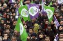 Supporters of the pro-Kurdish Peoples' Democratic Party (HDP) listen to party's co-leader Demirtas during a rally to protest against security operations in the Kurdish dominated southeast, in the eastern city of Van, Turkey