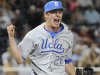 UCLA closing pitcher David Berg reacts after the final out against Mississippi State in the ninth inning of Game 1 of the NCAA College World Series baseball best-of-three finals, Monday, June 24, 2013, in Omaha, Neb. UCLA won 3-1. (AP Photo/Francis Gardler)