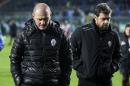 Cesena's coach Pierpaolo Bisoli, left, leaves the pitch at the end of a Serie A soccer match between Atalanta and Cesena in Bergamo, Italy, Sunday, Dec. 7, 2014. Atalanta fought back from two goals down to beat Cesena 3-2. (AP Photo/Felice Calabro')