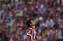 Atletico's Diego pauses, during a Spanish La Liga soccer match between Atletico Madrid and Malaga at the Vicente Calderon stadium in Madrid, Spain, Sunday May 11, 2014. (AP Photo/Gabriel Pecot)