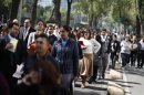 Office workers gather on Paseo de la Reforma avenue, after being evacuated from the Senate building, after an earthquake in Mexico City