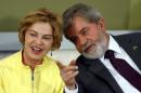 Brazil's President Lula da Silva talks with his wife Marisa Leticia during a ceremony at Planalto Palace in Brasilia
