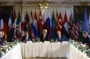 Russian Foreign Minister Lavrov, U.S. Secretary of State Kerry and U.N. envoy de Mistura attend a meeting in Vienna