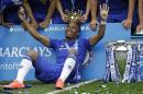 FILE - In this Sunday, May 24, 2015 file photo, the crown of the trophy is placed on the head of Didier Drogba after the English Premier League soccer match between Chelsea and Sunderland at Stamford Bridge stadium in London. Montreal Impact says it has signed former Chelsea striker Didier Drogba. Impact confirmed the signing on Monday, July 27, 2015 following a trade with Chicago Fire, which had initially completed a move for the 37-year-old forward. (AP Photo/Matt Dunham, File)