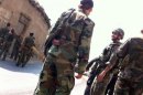 Syrian government soldiers set up a checkpoint in Damascus on Tuesday