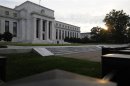 Sun rises to the east of the U.S. Federal Reserve building in Washington