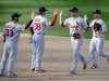 St. Louis Cardinals', from left, Daniel Descalso, Pete Kozma, Carlos Beltran and Shane Robinson high-five after Game 3 of the National League division baseball series against the Washington Nationals on Wednesday, Oct. 10, 2012, in Washington. St. Louis won 8-0. (AP Photo/Nick Wass)