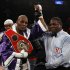 Hopkins poses for a photo with referee Brown after defeating Cloud in their IBF light heavyweight title in New York