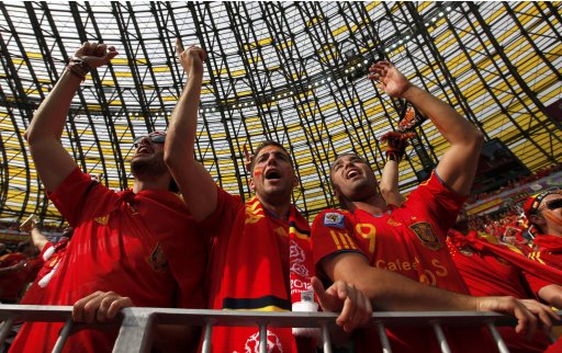 Spanish fans cheer as they wait for the start of the Group C Euro 2012 soccer match between Spain and Italy at the PGE Arena in Gdansk