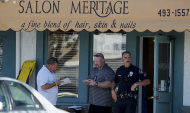 Investigators stand near the site where six people were killed and three were wounded in a shooting at a hair salon in Seal Beach, Calif., Wednesday, Oct. 12, 2011. The six deaths were confirmed and the other three victims were taken to a hospital in critical condition, police Sgt. Steve Bowles told The Associated Press. (AP Photo/Chris Carlson)