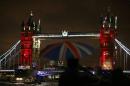 London's iconic Tower Bridge is illuminated in blue, white and red lights to suggest the colours of the French national flag in London on November 14, 2015, as Britons express solidarity in the wake of the Paris attacks of November 13