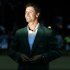 Adam Scott of Australia buttons his green jacket after winning the 2013 Masters golf tournament in Augusta