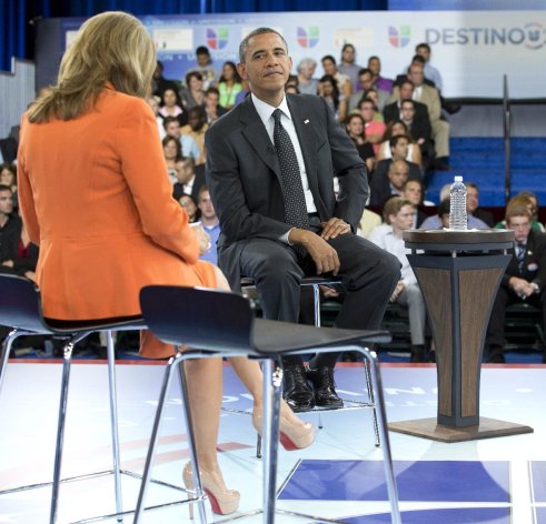 President Barack Obama participates in a town hall hosted by Univision and Univision news anchor Maria Elena Salinas, left, at the University of Miami, Thursday, Sept. 20, 2012, in Coral Gables, Fla.

   (AP

 Photo/Carolyn Kaster)