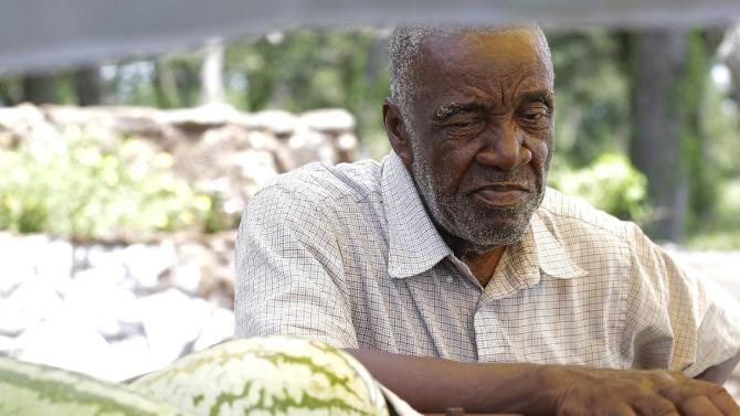 Sylvester Nunn leans against his pickup and talks about growing up in Waller County Wednesday, July 22, 2015, in Hempstead, Texas. Nunn sells watermelons from the back of his truck along the highway, a generations-old summer tradition. A more troubling tradition, of racial strife, has resurfaced here in the days since a black woman named Sandra Bland died in the county jail after a traffic stop by a white state trooper.  (AP Photo/Pat Sullivan)