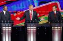 Donald Trump, center, speaks as Ben Carson, left, and Ted Cruz look on during the CNN Republican presidential debate at the Venetian Hotel & Casino on Tuesday, Dec. 15, 2015, in Las Vegas. (AP Photo/John Locher)