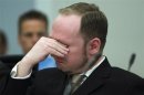 Norwegian mass killer Breivik cries as he watches a video presented by the prosecution during his trial in Oslo