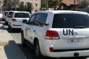 A convoy of United Nations vehicles is seen at the Lebanon-Syria Masnaa border crossing on October 1, 2013 as a chemical weapons disarmament team cross into Syria