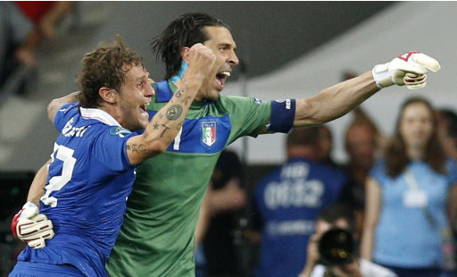 Italy's Alessandro Diamanti, left, and goalkeeper Gianluigi Buffon celebrate after winning the penalty shootout of the Euro 2012 soccer championship quarterfinal match between England and Italy in Kiev, Ukraine, Monday, June 25, 2012. (AP Photo/Michael Sohn)