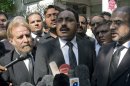 Tahir Naveed Chaudhry, center, the lawyer of a Christian girl accused of blasphemy, briefs reporters about a court proceeding in Islamabad, Pakistan on Thursday, Aug. 30, 2012. A judge hearing the case has delayed a bail hearing after a lawyer representing the man accusing the girl of burning the Quran challenged a medical report putting the girl's age at 14. (AP Photo/B.K. Bangash)