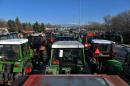 Tractors line the highway in front of the customs post at the border crossing between Greece and Bulgaria, in northern Greece, as farmers set up a blockade of customs offices on February 7, 2016