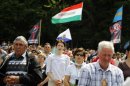 Ethnic Hungarians attend a religious service during the annual Roman Catholic Pentecostal pilgrimage gathering in Sumuleu Ciuc