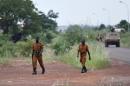 Soldiers of Burkina Faso's loyalist troops walk near the Naba Koom II barracks in Ouagadougou on September 30, 2015