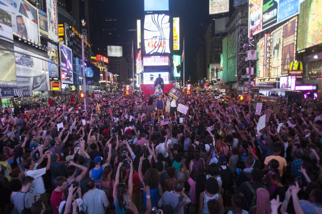 Protesters rally in response to the acquittal of George Zimmerman in the Trayvon Martin trial in Times Square in New York