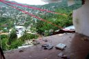 The wall of a home is missing after it fell during an earthquake in Acapulco, Wednesday, Aug. 21, 2013. The U.S. Geological Survey said the quake had a magnitude of 6.2 and was centered on the Pacific coast, near the resort of Acapulco. (AP Photo/Bernardino Hernandez)