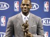 LeBron James poses after having accepted the NBA MVP trophy, Saturday, May 12, 2012 in Miami. Calling the honor "overwhelming" but pointing to a "bigger goal," James on Saturday became the eighth player in NBA history to win the MVP award three times. (AP Photo/Wilfredo Lee)