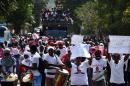 Supporters of ruling party candidate Jovenel Moise during a march in Port-au-Prince, Haiti on February 2, 2016