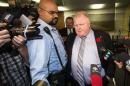 Toronto Mayor Ford reacts to a video released of him by local media at City Hall in Toronto