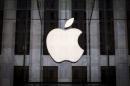 An Apple logo hangs above the entrance to the Apple store on 5th Avenue in the Manhattan borough of New York City