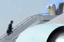 President Barack Obama walks up the steps of Air Force One at Boeing Field in Seattle, Wash., Wednesday, July 25, 2012. (AP Photo/Susan Walsh)
