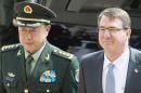 Chinese Gen. Fan Changlong Vice Chairman of China's Central Military Commission, arrives at the Pentagon on June 11, 2015, and stands with US Secretary of Defense Secretary Ashton Carter(R) in Washington, DC