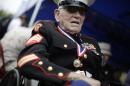 A U.S. veteran with uniform attends a ceremony commemorating the 70th anniversary of the Battle of Iwo Jima, now known officially as Ioto, Japan Saturday March 21, 2015. (AP Photo/Eugene Hoshiko)