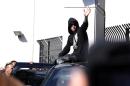 FILE - In this Jan. 23, 2014, file photo, singer Justin Bieber leaves the Turner Guilford Knight Correctional Center in Miami. A Miami-Dade County judge on Tuesday, Jan. 28 set a Feb. 14 arraignment date for the 19-year-old star on charges of DUI, resisting arrest and driving with an expired license. (AP Photo/El Nuevo Herald, Hector Gabino, File)
