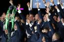 Ireland's players celebrate with the trophy after winning the Six Nations rugby union international tournament at Murrayfield stadium, Edinburgh, Scotland, Saturday, March 21, 2015. (AP Photo/Scott Heppell)
