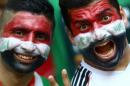 Iraqi fans pose at Turk Telecom stadium in Istanbul on July 13, 2013