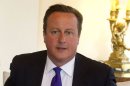 British Prime Minister David Cameron attends a meeting in central London on August 30, 2013