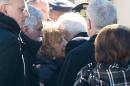 Giovanna Di Lorenzo, mother of Italian victim Fabrizia Di Lorenzo, is hugged by Italian President Sergio Mattarella upon her arrival from Berlin on a plane carrying the coffin of their daughter, at Rome's military airport of Ciampino, Saturday, Dec. 24, 2016. Di Lorenzo, 31, is among the 12 people who perished when a truck plowed through a Christmas market in Berlin last Monday. (Paolo Giandotti/Italian Presidential Press Service via AP)