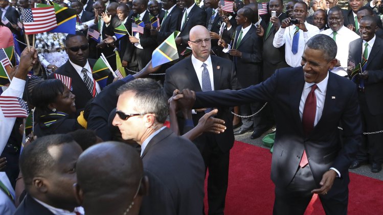 U.S. President Obama is greeted during an official arrival ceremony in Dar Es Salaam