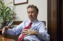 In this photo taken Feb. 10, 2015, Sen. Rand Paul, R-Ky. speaks in his office on Capitol Hill in Washington. Paul said he is likely to announce whether he'll run for president in 2016 sometime in March or April from his home state of Kentucky. The Kentucky Republican told reporters after a Friday speech in Louisville that he was getting closer to making a decision, but all signs point to Paul launching a campaign. Next month, he will ask the state Republican Party to create a presidential caucus in 2016. That way, Paul could run for president and re-election to his Senate seat simultaneously without appearing on the primary ballot for two offices. That's banned by Kentucky law. (AP Photo/J. Scott Applewhite)