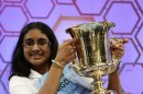 Snigdha Nandipati of San Diego, California, holds her trophy after winning the Scripps National Spelling Bee at National Harbor in Maryland