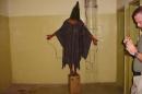 FILE - This is a 2003 file image obtained by The Associated Press which shows an unidentified detainee standing on a box with a bag on his head and wires attached to him in late 2003 at the Abu Ghraib prison in Baghdad, Iraq. An Iraqi Justice Ministry official said Wednesday, April 16, 2014 that this week's closure of the infamous Abu Ghraib prison west of Baghdad is temporary and that it will be reopened once the security situation in the surrounding area is stable. The closure is the latest chapter in the history of the prison, which during Saddam Hussein's rule was one of the main facilities for jailing and executing his opponents. After the U.S.-led invasion that toppled Saddam, Abu Ghraib became notorious once again, for a 2004 scandal over abuses of detainees by American guards. (AP Photo, File)