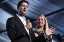 Republican vice presidential candidate, Rep. Paul Ryan, R-Wis., and wife Janna appear on stage at the Wisconsin delegation's Beers and Brats event, Wednesday, Aug. 29, 2012, in Tampa, Fla. (AP Photo/Mary Altaffer)