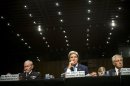 L-R: Martin E. Dempsey, John Kerry and Chuck Hagel listen during a hearing on Capitol Hill on September 3, 2013