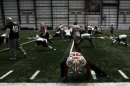 49ers cornerback Brown stretches with the rest of his team before practice for the Super Bowl in New Orleans
